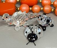Three crystal animal figurines grouped together