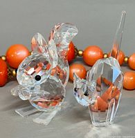 Front view of squirrel and cat crystal figurines