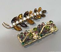 Front view of both brooches showing design and stones