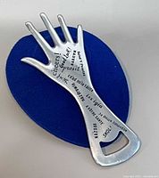 Front view showing multilingual text and hand shape