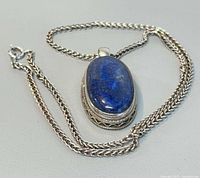 Full view of necklace showing chain and pendant front