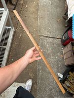 Full view of wooden ruler with scale markings