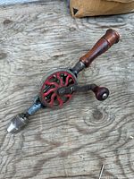 Full view of antique hand crank drill showing overall design