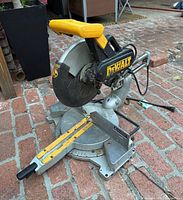 Overall view of DeWalt DW708 saw on brick surface