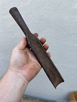 Entire gouge chisel showing blade curvature and socket