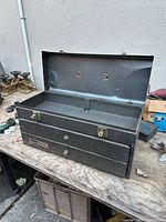Toolbox open showing top compartment and two drawers