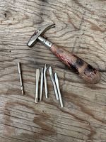 Hammer multitool with six steel bits laid out