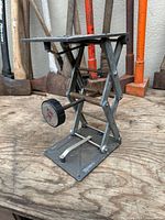 Scissor jack fully extended on workbench