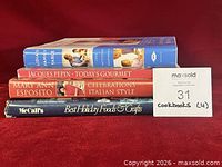 Stack of four cookbooks spine view identifying titles
