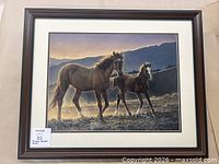 Full view of framed print showing artwork, matting, and frame