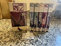 All six Winsor Pilates VHS tapes lined up showing spines and titles