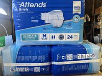 Three Attends Briefs packs showing front panel with size, absorbency and count