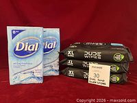 Front view showing two Dial 8-bar packs and three Dude Wipes XL packs