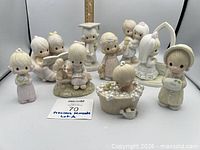 All nine Precious Moments figurines grouped