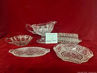 Group shot of all five clear pressed glass serving pieces