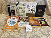 All eight items arranged on tablecloth showing front covers and DVD case