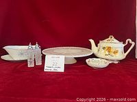 Group shot of all serveware items on red backdrop