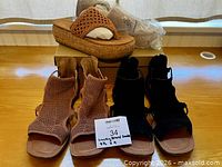 Overview of three sandal pairs on table