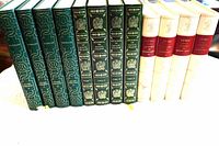Spine view of all 12 gilt hardcover volumes