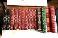 All 15 leather-bound books side by side, showing spines