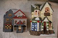 Front view of both ceramic Christmas village houses