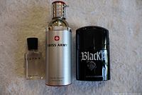 Group shot of Avatar, Swiss Army, and Black XS cologne bottles