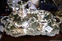 Full view of five-piece Birks Regency silver-plate tea and coffee service on ornate tray
