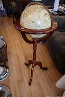 Full view of globe on mahogany tripod stand
