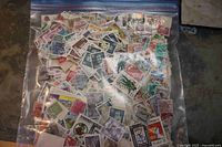 Full view of resealable bag packed with assorted stamps