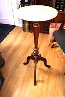 Full view of stand showing pedestal and marble top