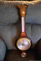 Full view of walnut wall barometer showing all three instruments