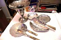 All eight silverplate items displayed together for overview