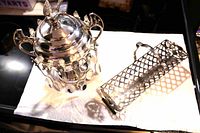 spooner with spoons beside biscuit holder