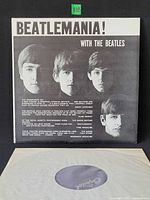 Front cover showing portraits of Beatles and title