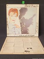 Front cover of David Bowie Scary Monsters LP with lyric inner sleeve