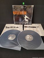 Front view of gatefold jacket with shrink and both vinyl discs in sleeves