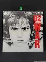 Front cover with U2 WAR title and child portrait