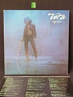 Front cover of Toto Hydra LP with lyric sleeve visible