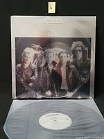 Front cover and vinyl record displayed