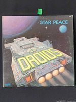 Front sleeve showing artwork and titles