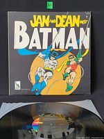 Front sleeve showing title, artists and comic artwork