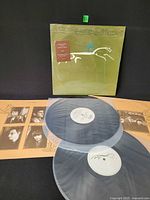 Front view of shrink-wrapped album with sticker