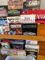 Front view of rack showing mix of automotive books and magazines
