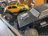 Group view of all three RC cars on tabletop