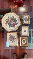 Group shot of all five framed petit point artworks