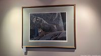 Full view of framed Robert Bateman print on wall