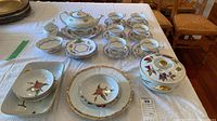 Overview of entire lot including Royal Albert tea service and Royal Worcester fruit-motif pieces