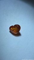 Heart-shaped orange Spessartite garnet front view