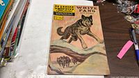 Front cover of Classics Illustrated No. 80 comic showing title, wolf illustration, 15¢ price