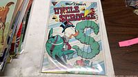 Front cover of Uncle Scrooge comic #230 in protective sleeve